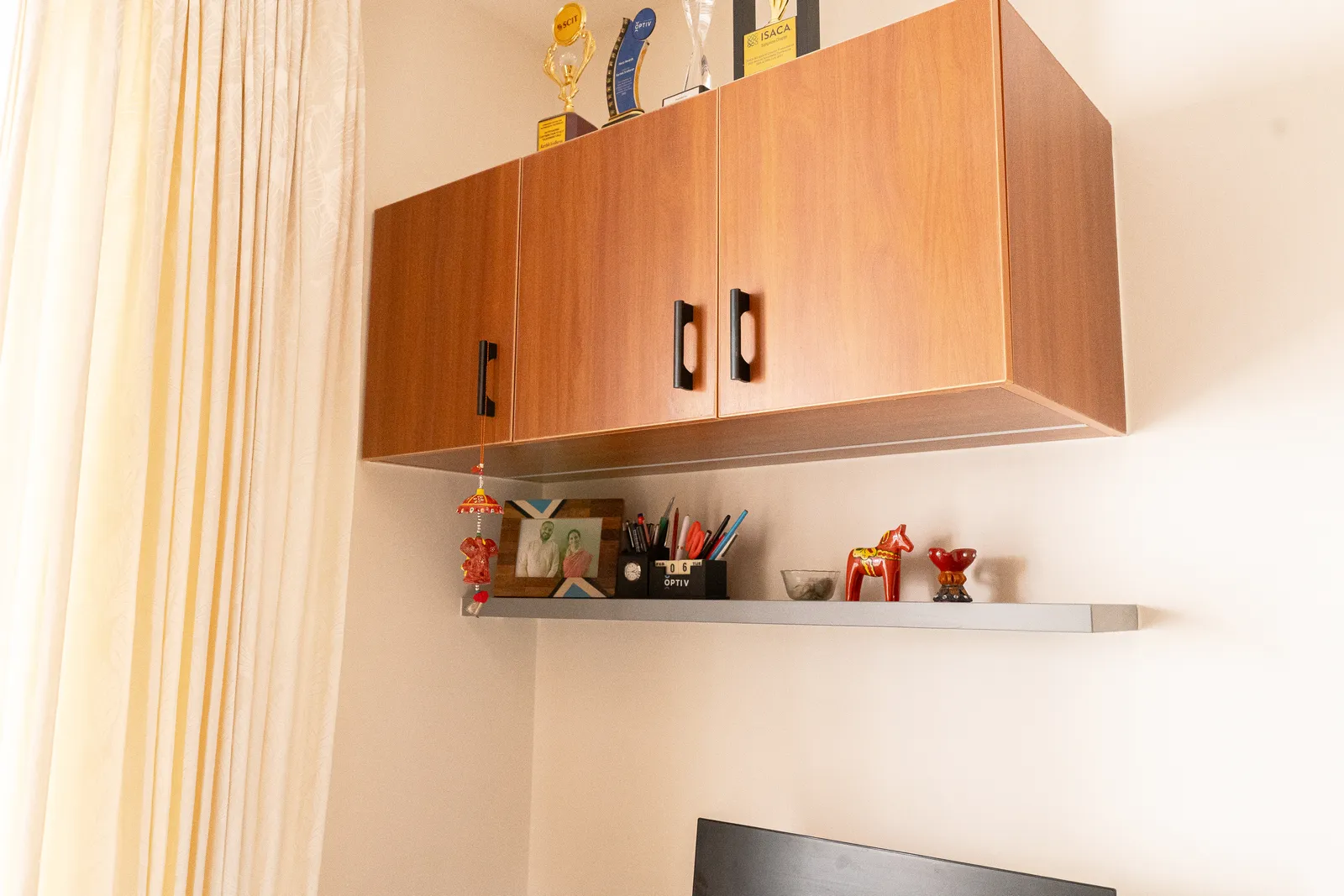 Wall-mounted teak cabinet with floating shelf — Karthik's Residence